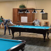 Shooting Pool at Kings Point Billiard Club of Sun City Center, FL
