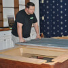 Maine Home Recreation Owner Shane Setting Up a Pool Table
