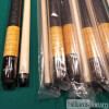 Stack of Meucci SWBB 1 Pool Cues