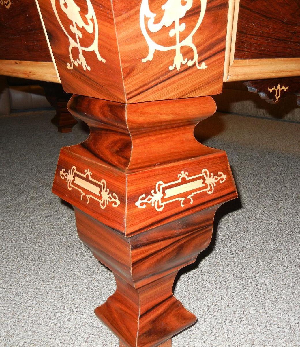 Example of a restored Brunswick pool table from the 1980s with intricate inlay work
